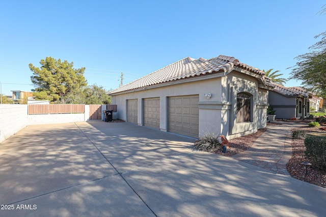 view of side of property with a garage