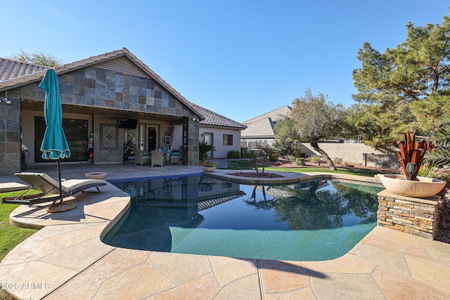 view of pool featuring a patio