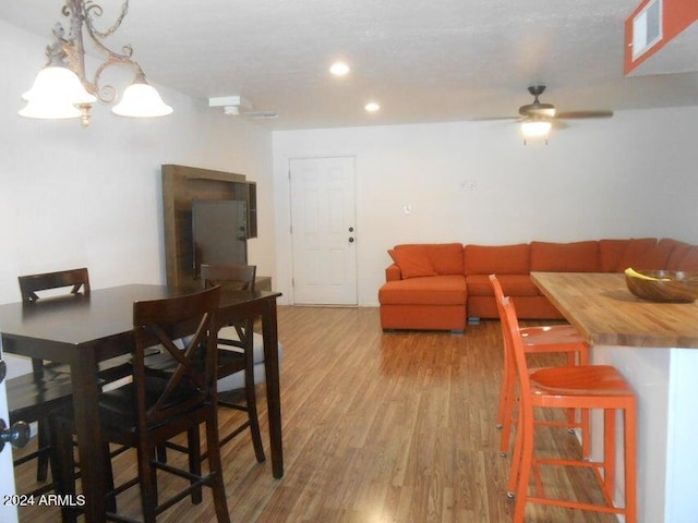 dining room featuring hardwood / wood-style flooring and ceiling fan