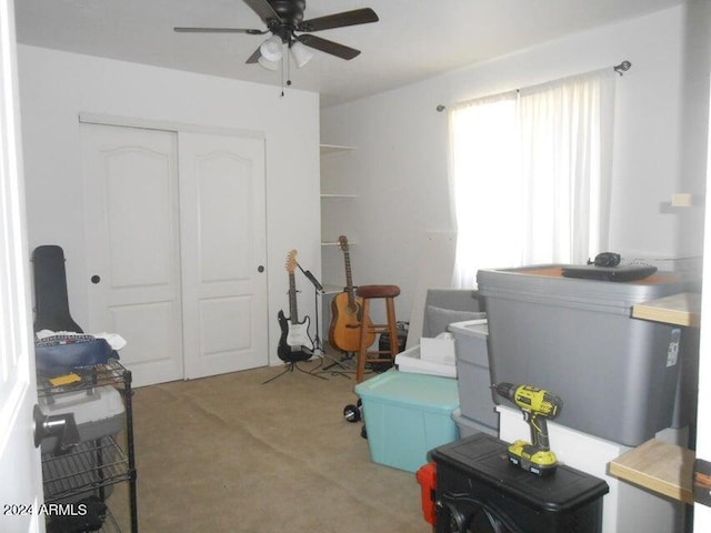 misc room featuring carpet and ceiling fan