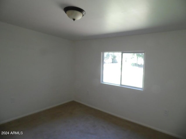 unfurnished room with carpet floors