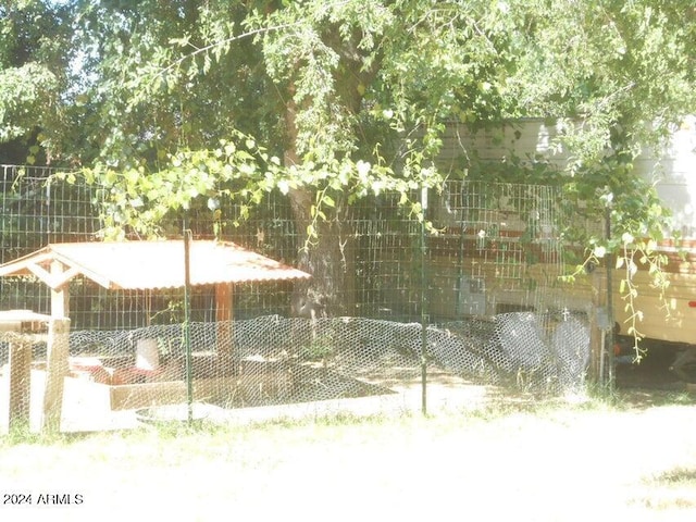 view of home's community featuring an outbuilding