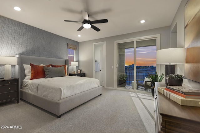 bedroom featuring recessed lighting, an accent wall, carpet flooring, access to outside, and wallpapered walls