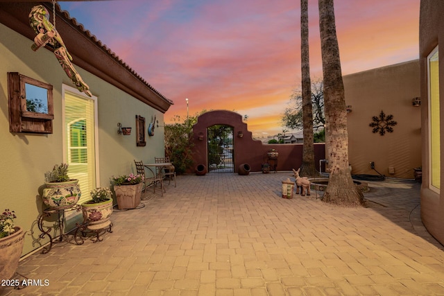 view of patio featuring a gate