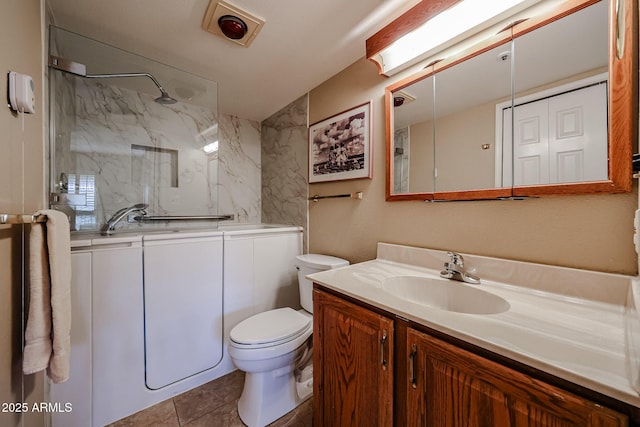 bathroom with vanity, toilet, and tile patterned flooring