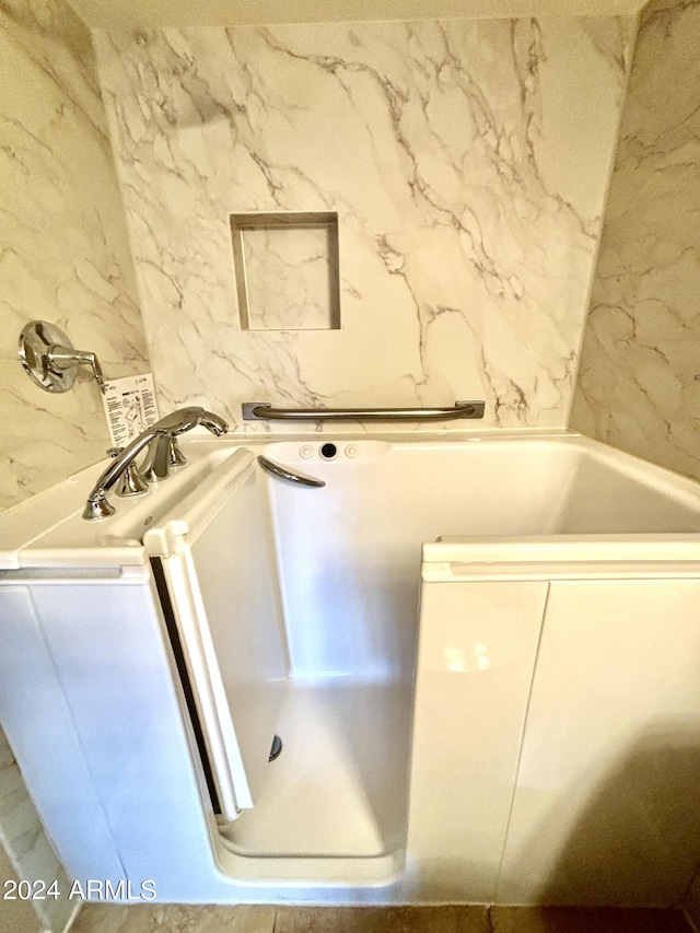 bathroom featuring a tub to relax in