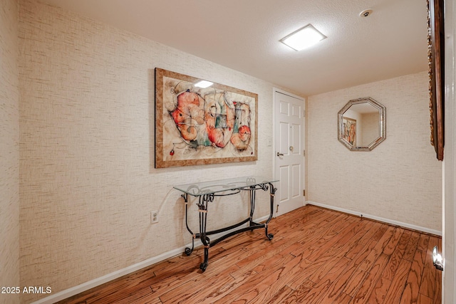 hall with light hardwood / wood-style floors