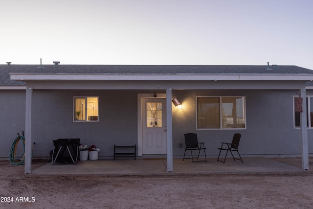 back of house with a patio area