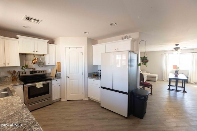 kitchen with white cabinets, stainless steel electric range oven, and dark wood-type flooring