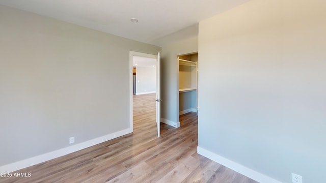 4151 E Clovis Ave, Mesa, AZ 85206 - unfurnished bedroom featuring baseboards, light wood-type flooring, and a closet