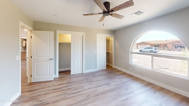 4151 E Clovis Ave, Mesa, AZ 85206 - unfurnished bedroom featuring light wood-style floors, baseboards, and ceiling fan