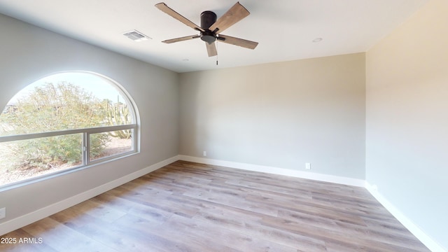 4151 E Clovis Ave, Mesa, AZ 85206 - unfurnished room with ceiling fan, light wood-type flooring, and baseboards