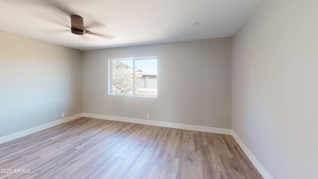4151 E Clovis Ave, Mesa, AZ 85206 - empty room featuring light wood-type flooring, a ceiling fan, and baseboards