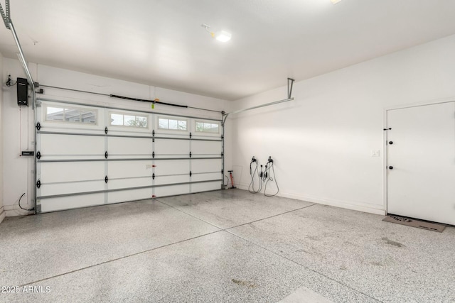 garage featuring baseboards