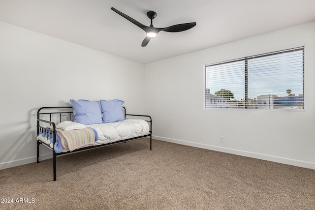 carpeted bedroom with ceiling fan