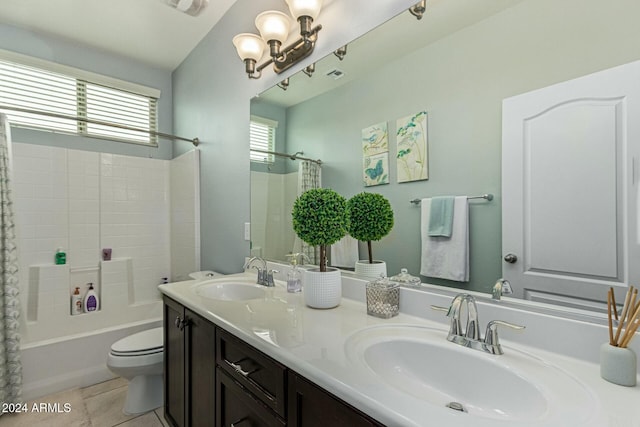 full bathroom featuring double vanity, shower / bath combination with curtain, a sink, and tile patterned floors