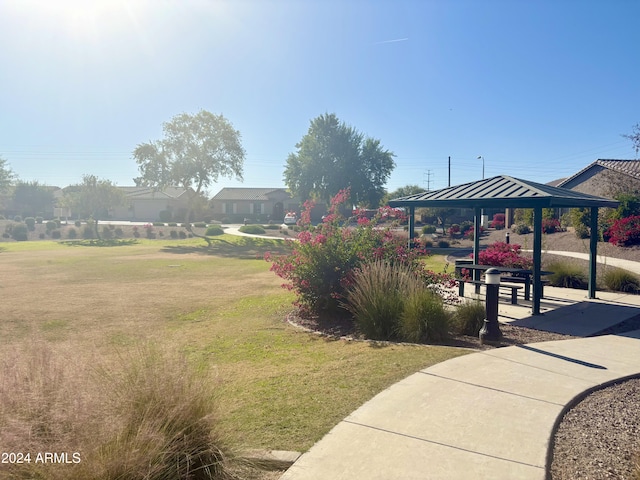 view of property's community featuring a lawn and a gazebo