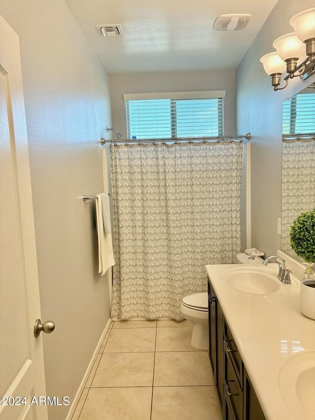 full bath with double vanity, visible vents, toilet, a sink, and tile patterned floors