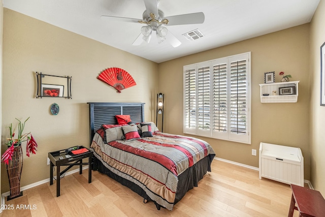 bedroom featuring ceiling fan and light hardwood / wood-style flooring