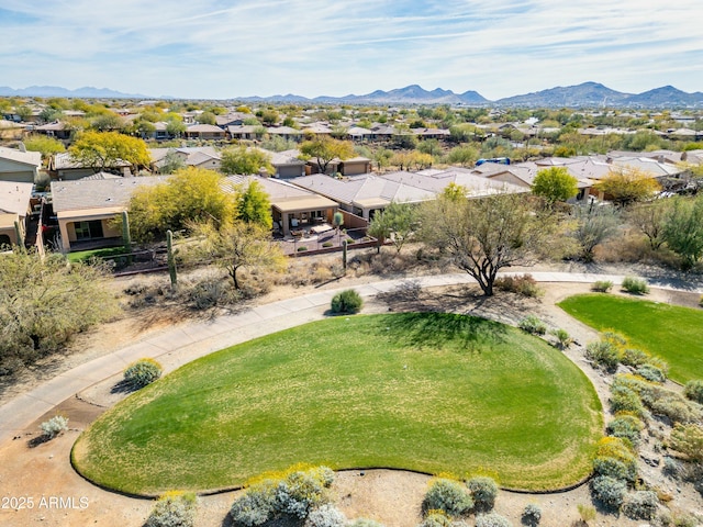 birds eye view of property with a mountain view