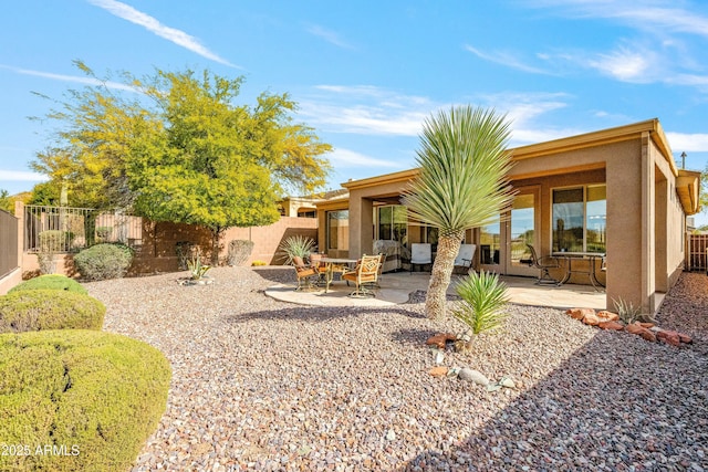 back of house with a patio area