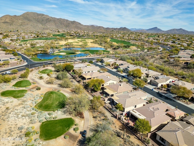 drone / aerial view featuring a water and mountain view