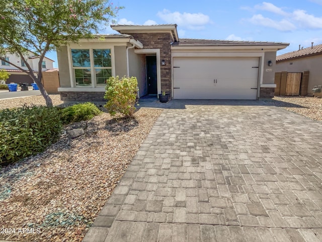 view of front of property with a garage