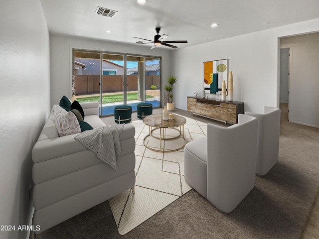 carpeted living room with ceiling fan