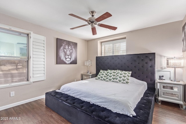 bedroom featuring dark wood-type flooring and ceiling fan