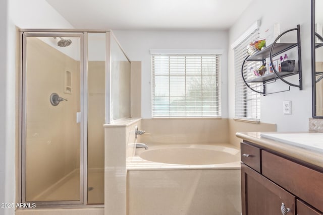 bathroom featuring vanity and separate shower and tub