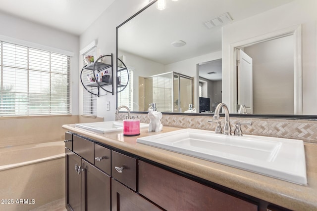 bathroom with vanity and plus walk in shower