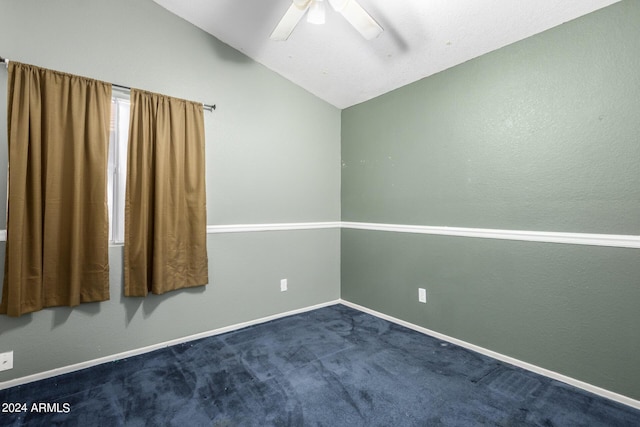 unfurnished room featuring carpet, vaulted ceiling, and ceiling fan