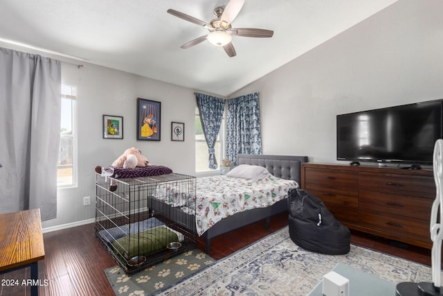 bedroom featuring lofted ceiling, multiple windows, ceiling fan, and dark hardwood / wood-style floors