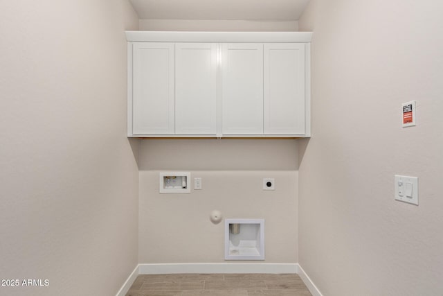 washroom featuring light hardwood / wood-style flooring, hookup for a washing machine, cabinets, hookup for a gas dryer, and hookup for an electric dryer