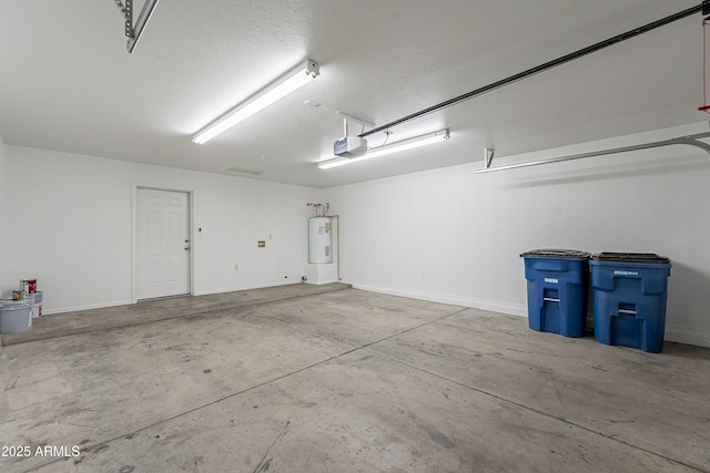 719 E Broadway Ave, Apache Junction, AZ 85119 - garage with water heater, a garage door opener, and baseboards