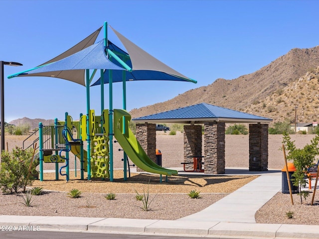 view of playground with a mountain view