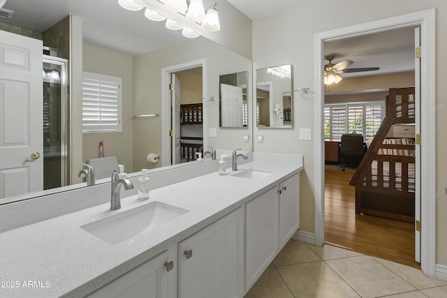 bathroom featuring visible vents, a sink, a ceiling fan, and tile patterned floors
