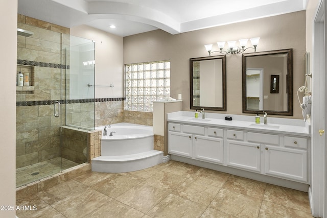 full bath with a sink, a garden tub, a stall shower, and double vanity