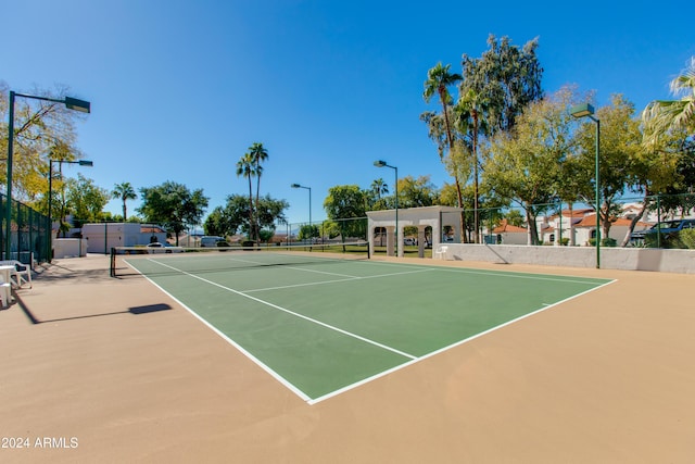 view of sport court featuring basketball hoop