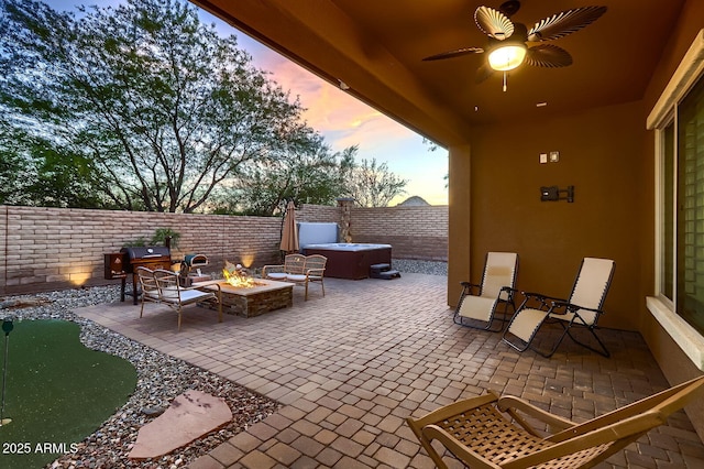 13145 W Whisper Rock Trl, Peoria, AZ 85383 - fenced backyard featuring an outdoor fire pit, a patio area, a hot tub, and a ceiling fan