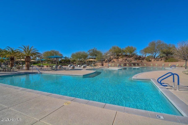 13145 W Whisper Rock Trl, Peoria, AZ 85383 - community pool with a patio area