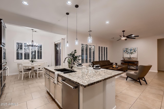 13145 W Whisper Rock Trl, Peoria, AZ 85383 - kitchen with light tile patterned floors, dishwasher, an island with sink, light stone counters, and recessed lighting