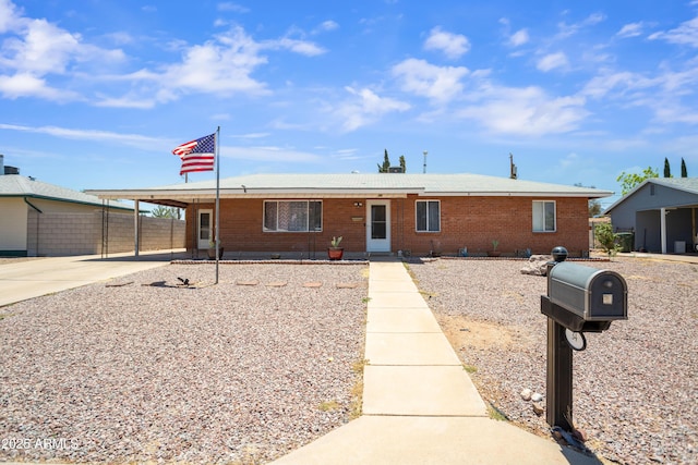 34 E Freihage Dr, Sierra Vista, AZ 85635 - view of front of house featuring brick siding, driveway, and an attached carport