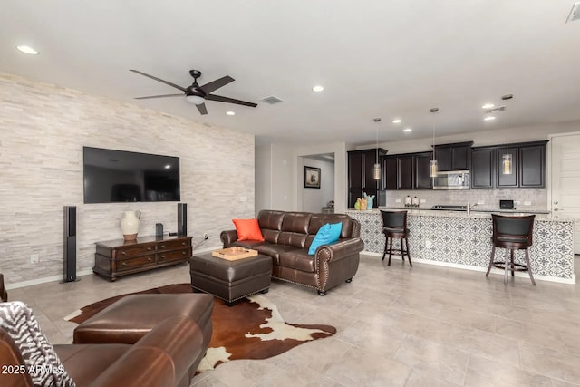 living room featuring ceiling fan