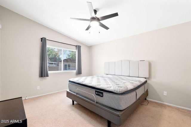 carpeted bedroom featuring baseboards, ceiling fan, and lofted ceiling