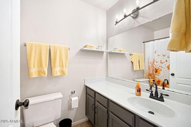 full bathroom with toilet, curtained shower, and vanity