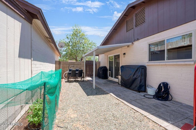 view of patio / terrace featuring a fenced backyard and grilling area
