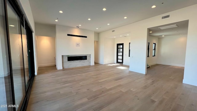 unfurnished living room featuring light wood-type flooring