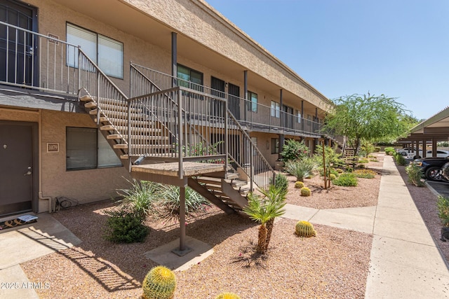 view of home's community featuring stairs