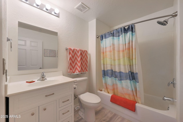 full bathroom with toilet, vanity, shower / bathtub combination with curtain, and hardwood / wood-style floors